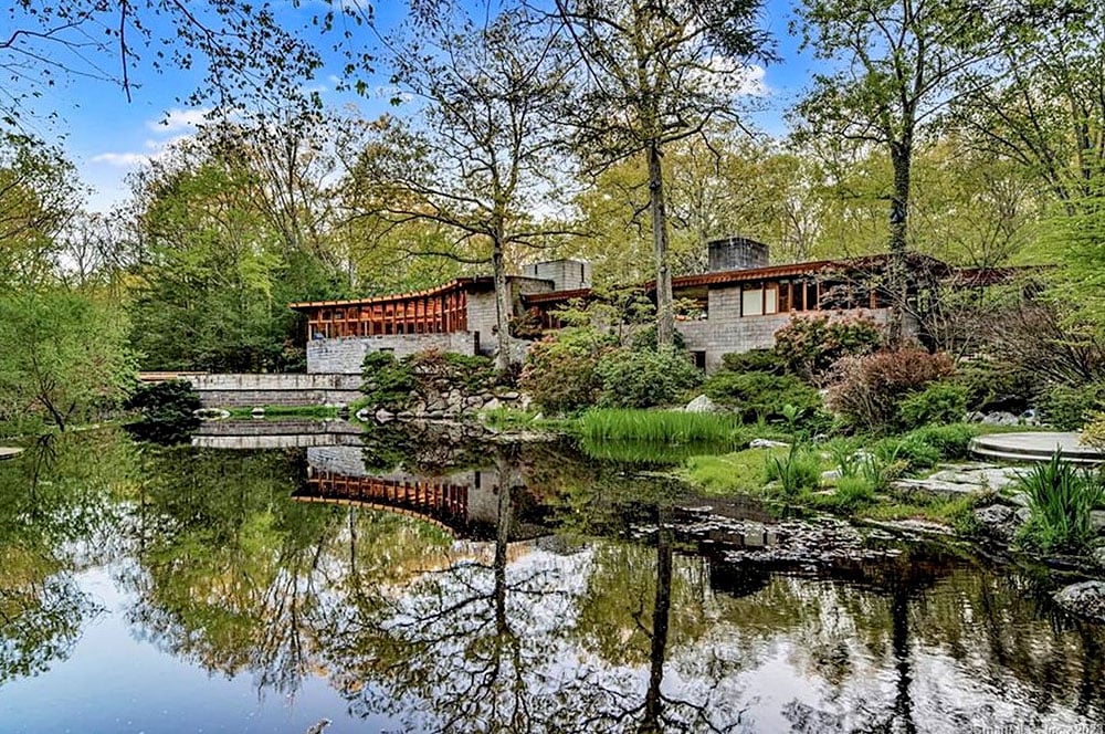 Frank Lloyd Wright's home for Joyce and John Rayward in Connecticut features a semicircular style reminiscent of the Guggenheim Museum in New York City. Courtesy of Coldwell Banker Realty.