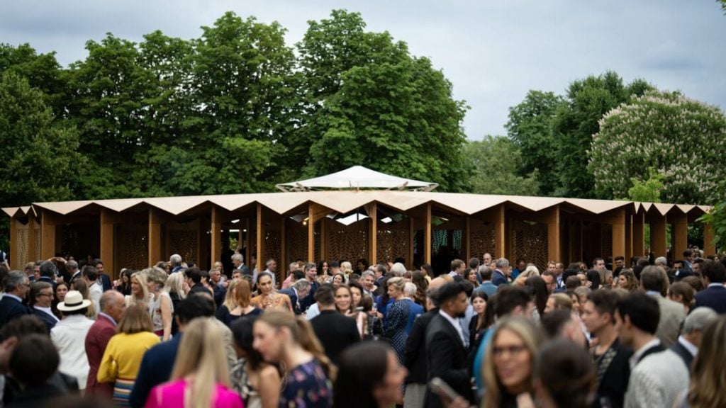 Guests with Lina Ghotmeh's Serpentine Pavilion at the Serpentine Gallery Summer Party 2023 at the Serpentine Gallery in London, England. Photo by Darren Gerrish/Getty Images for the Serpentine Gallery.