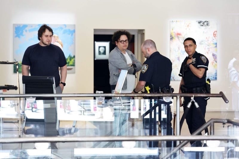 Art dealer Georges Bergès talks to NYPD officers at his Soho gallery on June 1, after an alleged hack of financial documents related to Hunter Biden, who the gallery represents as an artist. Image courtesy Georges Bergès.