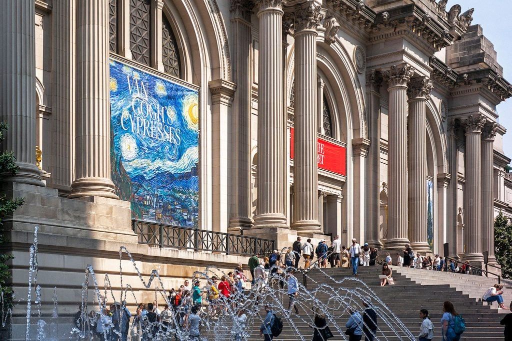 People line up to enter the Metropolitan Museum of Art for a preview of 