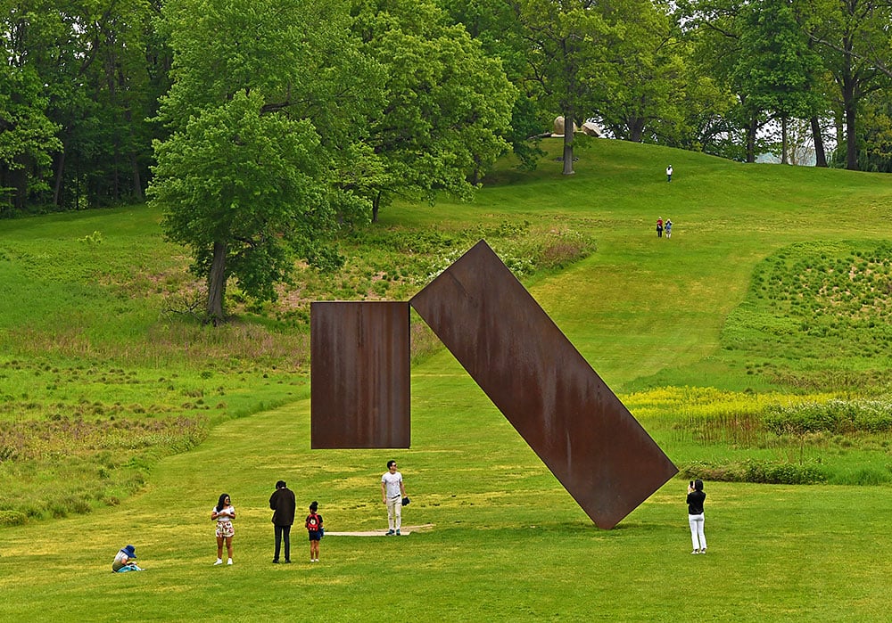 Visitors gather around Menashe Kadishman's artwork </em>Suspended</em> at Storm King Art Center in New York on May 21, 2023. (Photo by Li Rui/Xinhua via Getty Images)