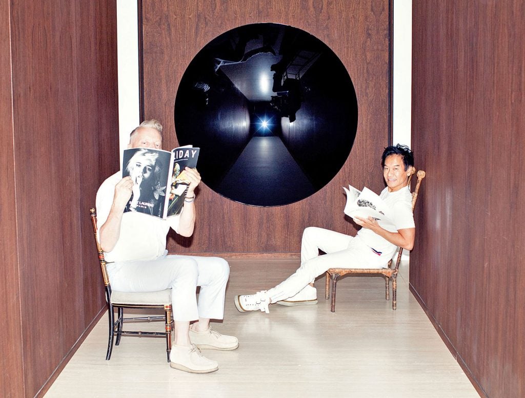 Glenn Pushelberg and George Yabu with a circular lacquer dish by Anish Kapoor. Courtesy of George Yabu & Glenn Pushelberg.