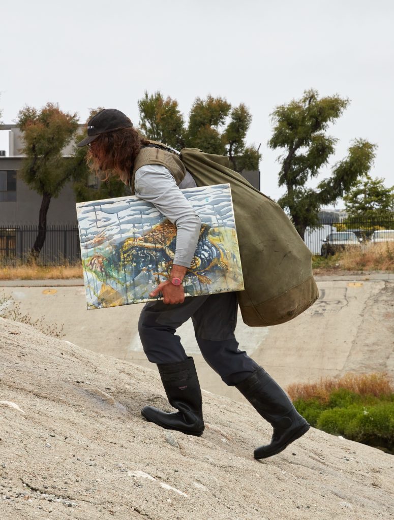 Sterling Wells working in Ballona Creek, Los Angeles. Photo by Nik Massey, courtesy of Night Gallery, Los Angeles. 
