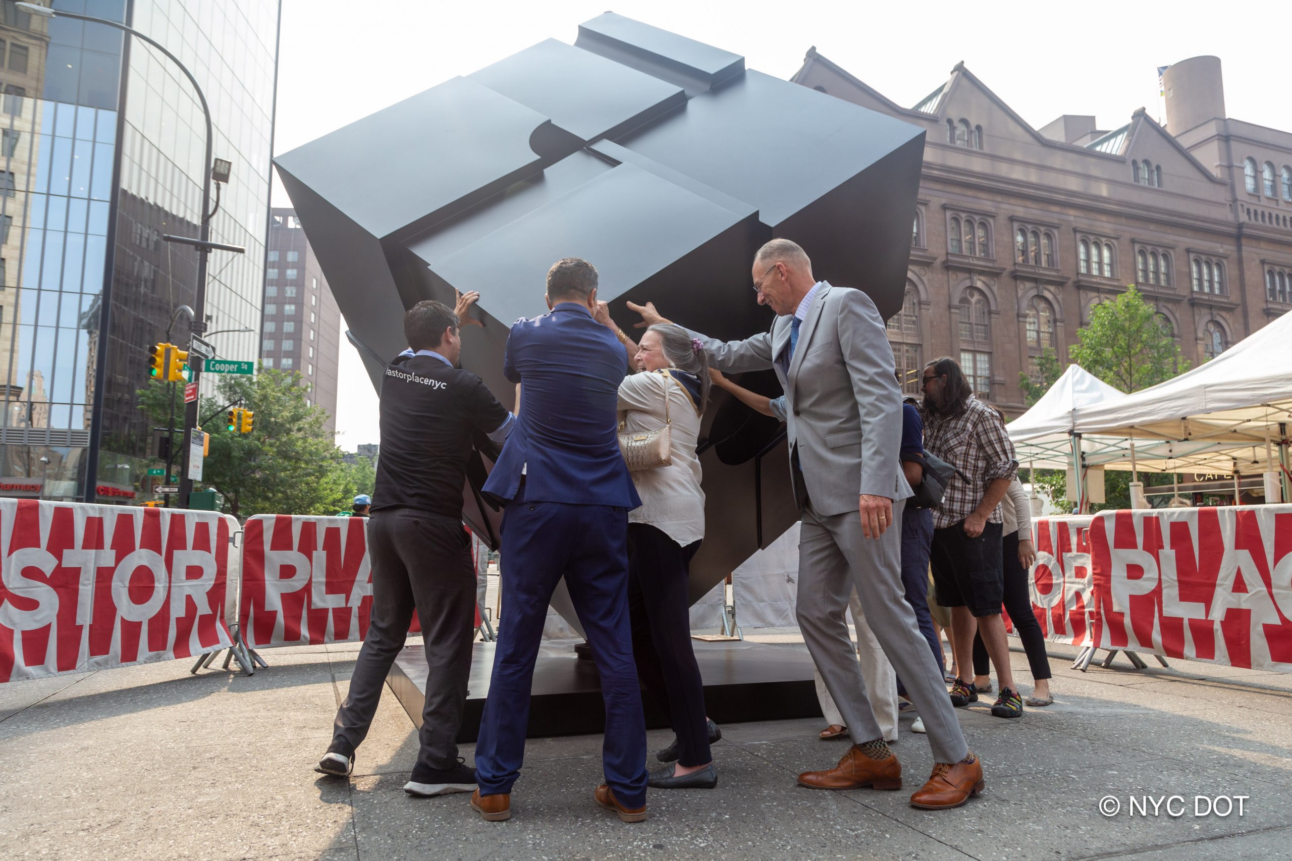 Bernard "Tony" Rosenthal's Alamo, better known as the Astor Place Cube, being unveiled in a ceremony following repairs by Versteeg Art Fabricators that have restored its ability to spin. Photo courtesy of the New York City Department of Transportation.