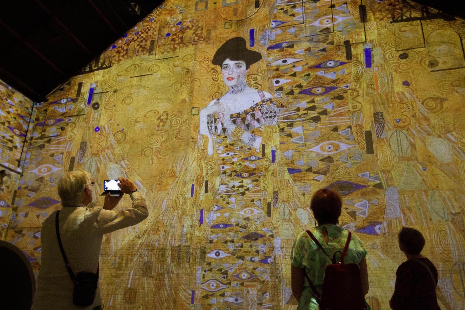 Visitors view a digital version of Klimt's Portrait of Adele Bloch-Bauer I in Amsterdam in 2022.