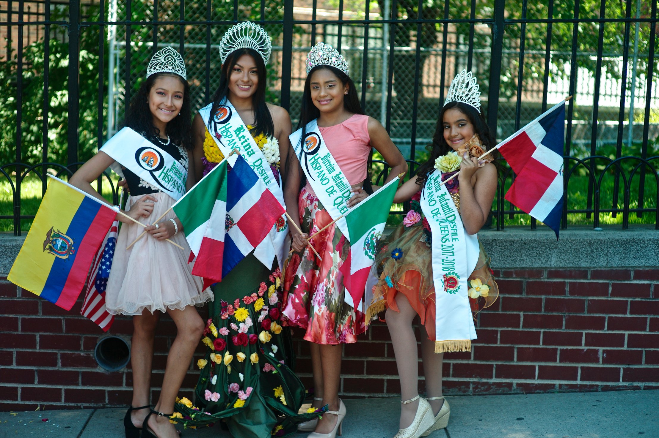 Teen queens of the Queens Hispanic Parade in New York at the celebration of the Flower Festival in New York. This photo is included in "¡Presente! A Latino History of the United States" at the Molina Family Latino Gallery at the Smithsonian Institution's National Museum of American History in Washington, D.C. Photo by Kike Calvo/Universal Images Group via Getty Images.