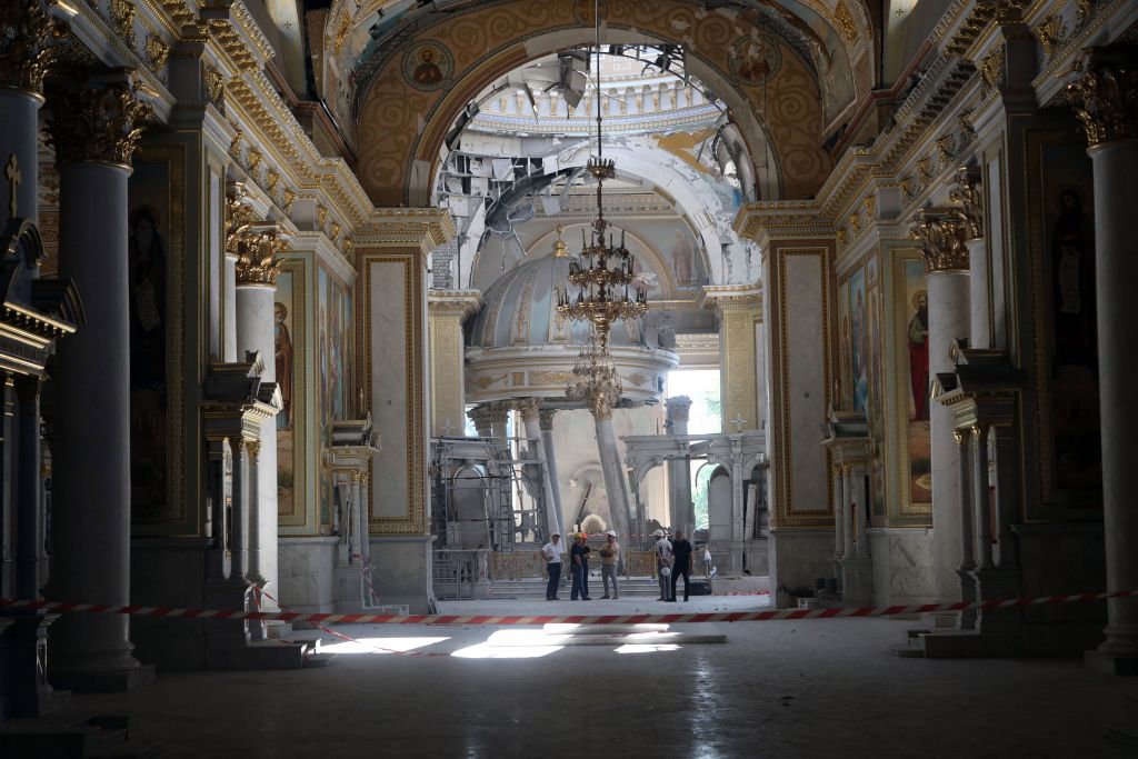 A comission examines destruction in Transfiguration Cathedral damaged as a result of a missile strike in Odesa on July 23, prior service on July 24, 2023, amid the Russian invasion of Ukraine. Photo by OLEKSANDR GIMANOV/AFP via Getty Images.