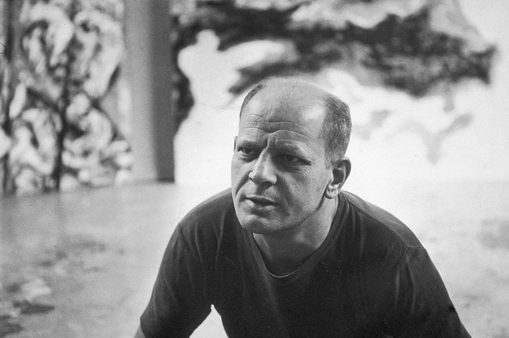 Abstract Expressionist painter Jackson Pollock in his studio.