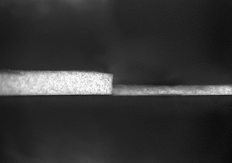 The world's whitest paint previously required a layer 0.4 millimeters thick to achieve sub-ambient radiant cooling. A new thinner, lighter formulation can work just as well at just 0.15 millimeters thick. Photo by Andrea Felicelli, courtesy of Purdue University.