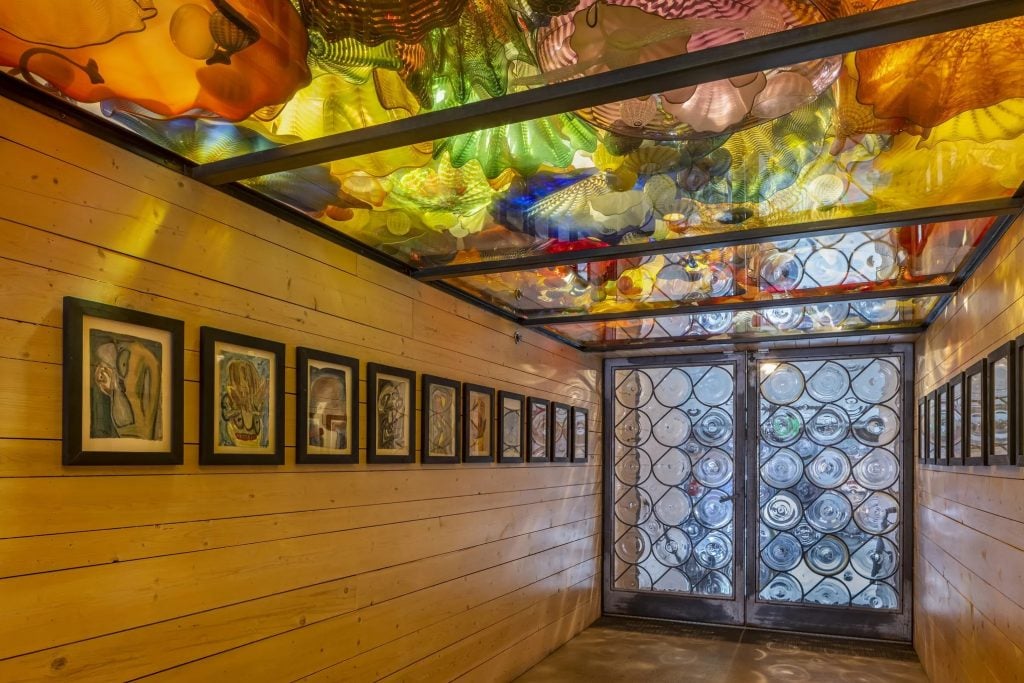 The Rondel doors, a Persian Ceiling, and work by Michael Lawson at the Boathouse, Dale Chihuly's Seattle studio. Photo by Nathaniel Willson, ©2023 Chihuly Studio.