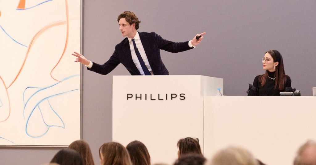 Auctioneer Henry Highley presides over the Phillips London contemporary art evening sale in March 2023.