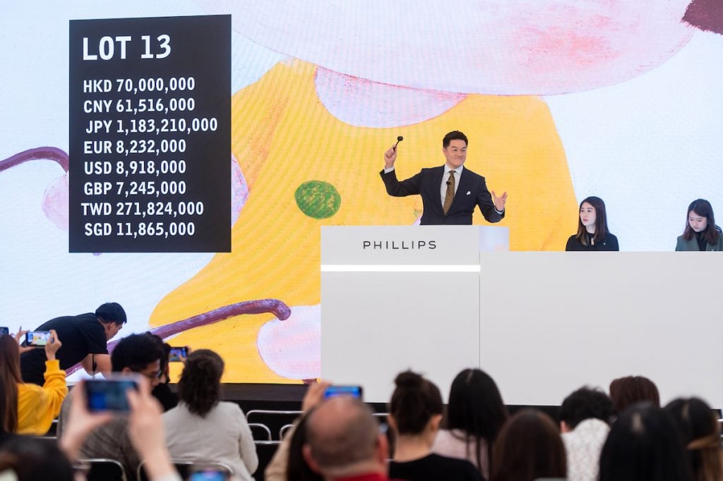 Phillips Asia Chairman Jonathan Crockett sells Yoshitomo Nara’s Lookin’ for a Treasure during the inaugural auction in Phillips’s new Asia headquarters.
