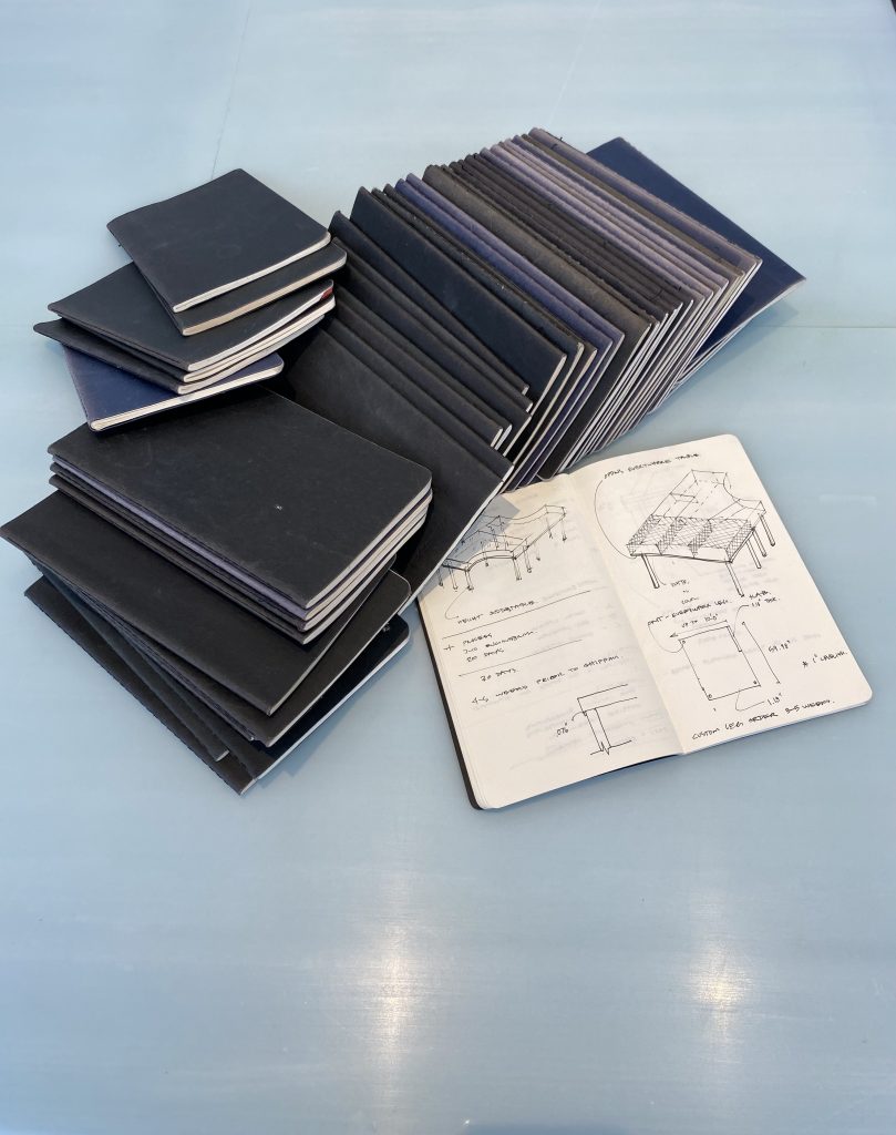 Christopher Leong's collection of moleskin notebooks.