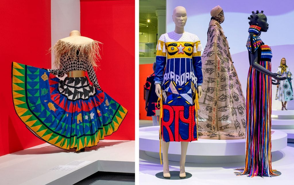Left: A handwoven masquerade skirt by Studio One Eighty Nine, 2018. Right: A dress by Brooklyn designer Christopher John Rogers and a dress by Bull Doff, made of upcycled plastic objects found in Dakar, Senegal. Courtesy of the Brooklyn Museum.