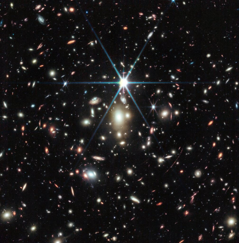 NASA’s James Webb Space Telescope captured this image of a massive galaxy cluster called WHL0137-08, which contains the most strongly magnified galaxy known in the universe’s first billion years: the Sunrise Arc, and within that galaxy, the most distant star ever detected, Earendel. Image courtesy of NASA, ESA, CSA, D. Coe (STScI/AURA for ESA; Johns Hopkins University), B. Welch (NASA’s Goddard Space Flight Center; University of Maryland, College Park). Image processing: Z. Levay.