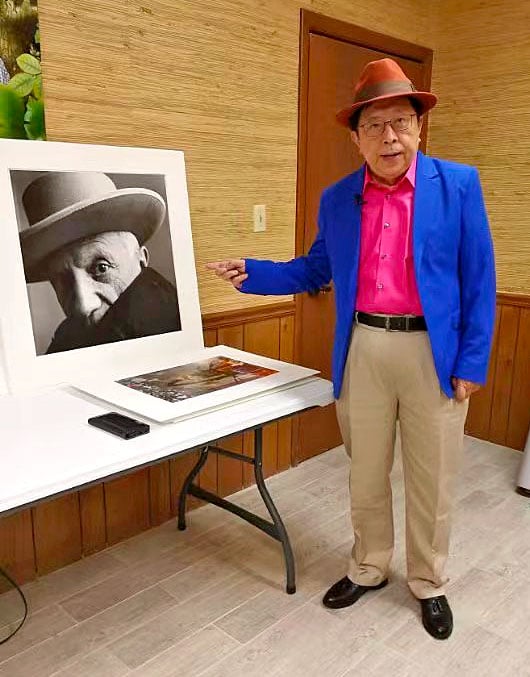 Charles Jin with Irving Penn's <em>Pablo Picasso at La Californie, Cannes</em> (1957). Courtesy of Charles Jin.
