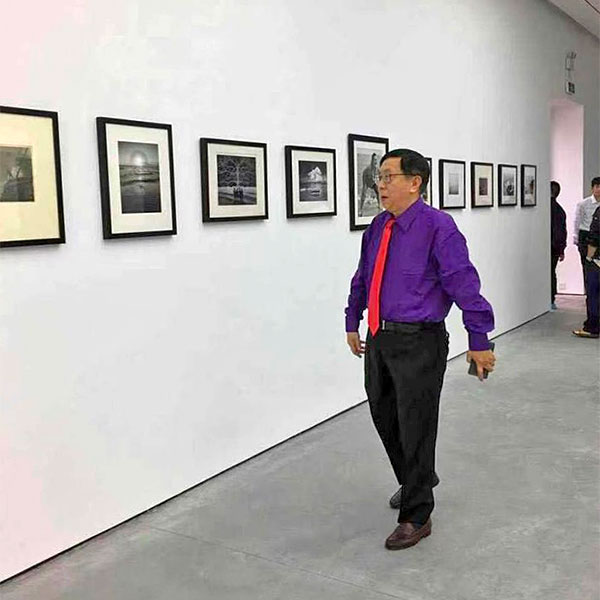 Charles Jin in an exhibition of his collection called "Sea Series" at Sanya Contemporary Museum in Hainan, 2017. Courtesy of Charles Jin.