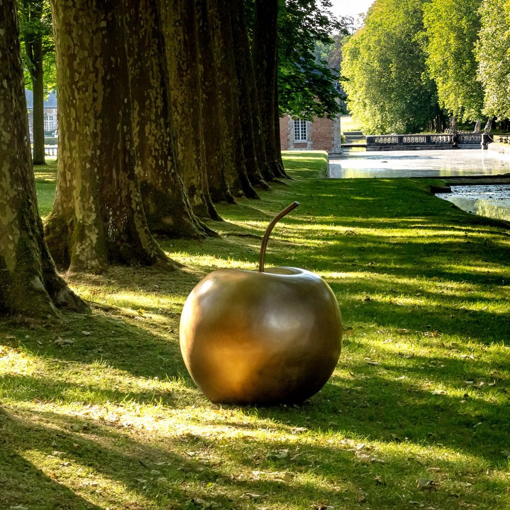 Claude Lalanne, <em>Pomme de Londres</em> (estimate: $668,000–$891,000, photographed in the gardens of the Château de Courances. Courtesy of Sotheby's Paris.