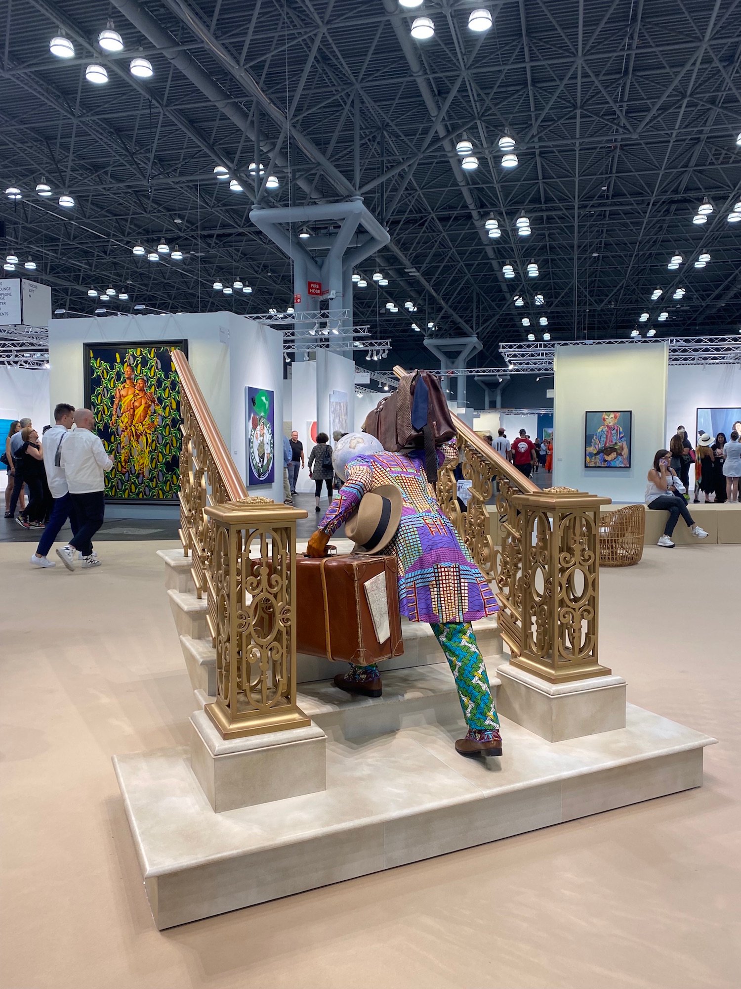 Installation view of Yinka Shonibare. Man Moving Up (2022) at the "Platform" section of The Armory Show 2023. Photo by Eileen Kinsella.