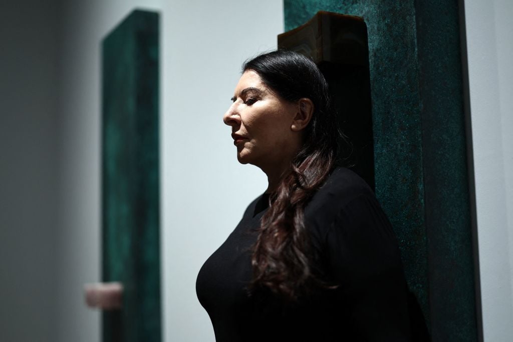 Serbian performance artist Marina Abramovic poses with one of her artworks, entitled 'Portal', during a photocall at the Royal Academy of Arts (RA) in London on September 19, 2023, ahead of an exhibition of her work. Photo by Henry Nicholls/AFP via Getty Images.
