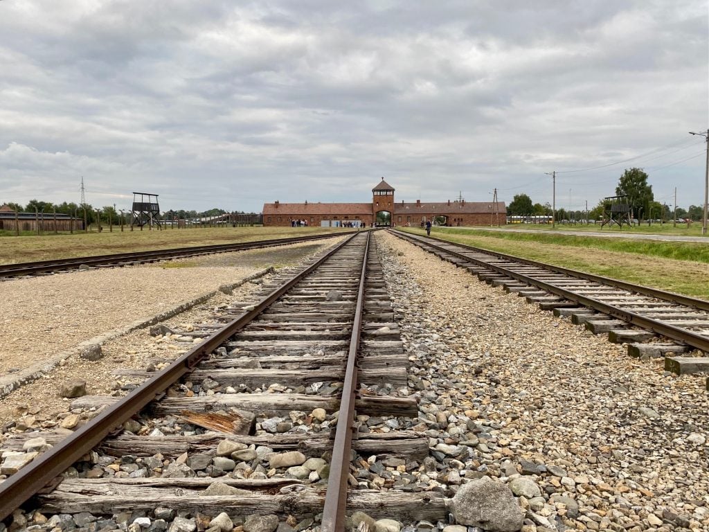The train tracks leading to the station at the Auschwitz concentration camp. Photo by Sarah Cascone. 