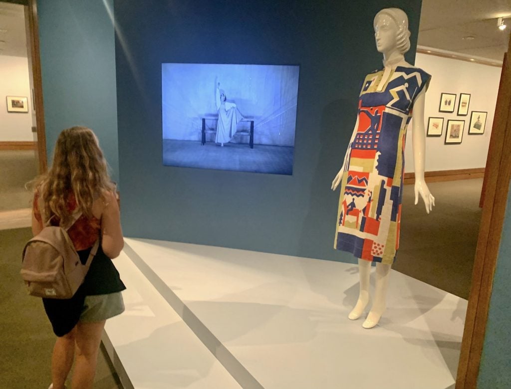Entrance to “Art for the Millions: American Art in the 1930s” at the Metropolitan Museum of Art, featuring a film of Martha Graham performing Frontier (1935) and a Dress by Ruth Reeves (ca. 1930)