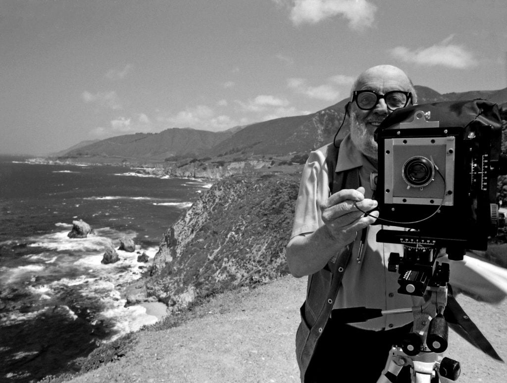 Ansel Adams stands on a bluff above the Pacific Ocean. Photo: Roger Ressmeyer CORBIS VCG via Getty Images.
