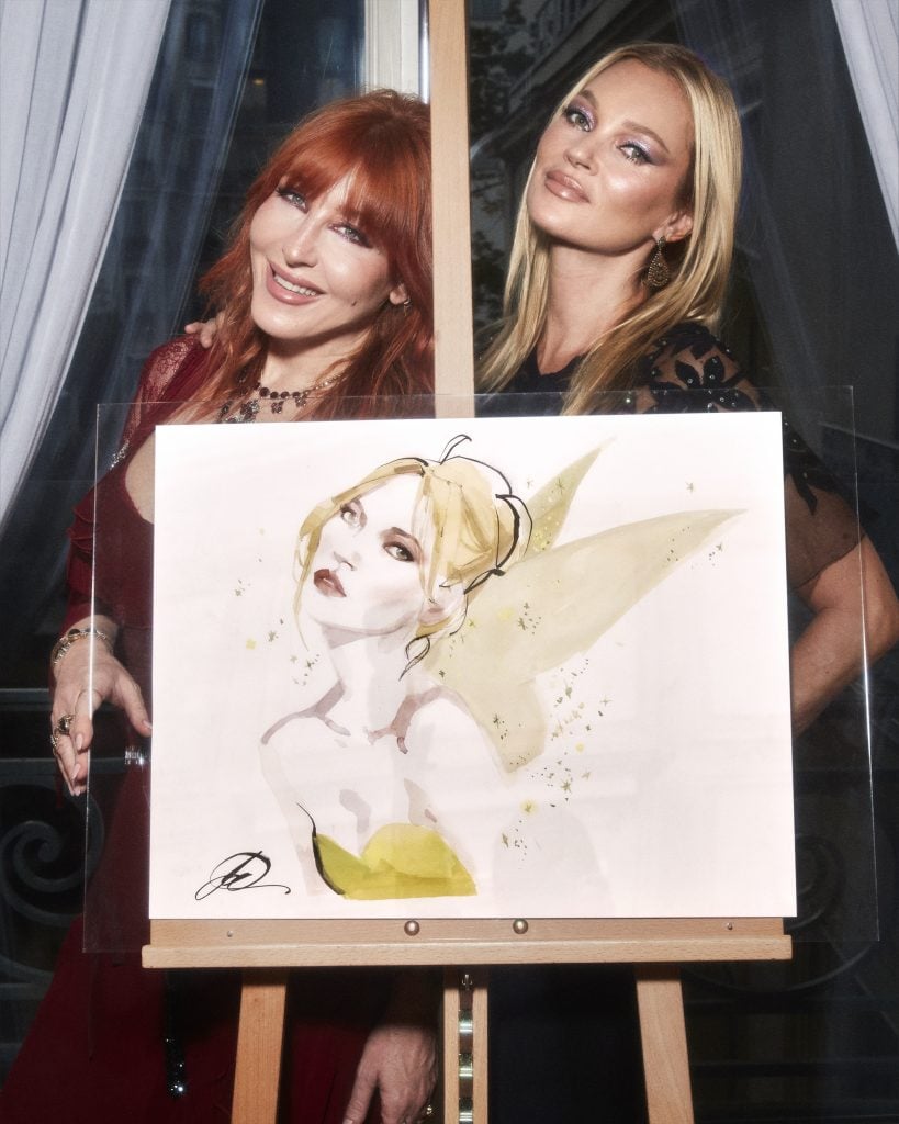 A portrait of Kate Moss in a look inspired by Disney's Tinkerbell by David Downton. Donated By Charlotte Tilbury. Photo courtesy of Disney