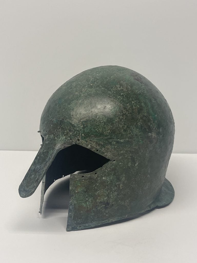 Corinthian bronze helmet. Image via District Attorney New York.