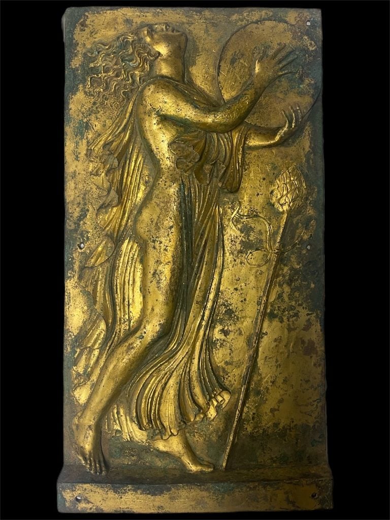 A gilded Bronze Plaque with Maenad and Tambourine. Image via District Attorney New York.