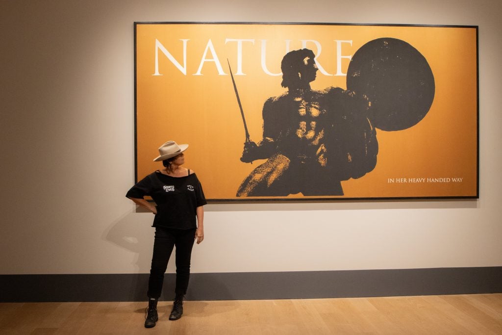 Chan Marshall admires Marc Hundley's Nature. Photo: Elvin Tavarez. 