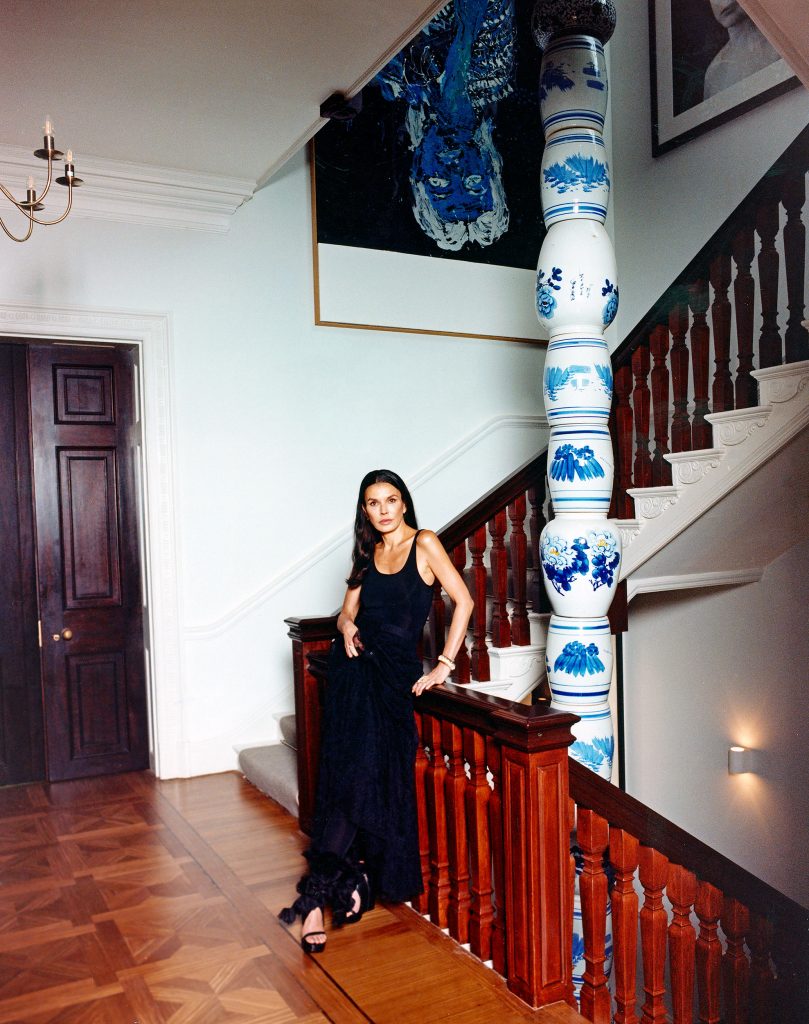 Hélène Nguyen-Ban with Georg Baselitz's <em>Elke negativ blau</em> (2012) above the stairs, left.