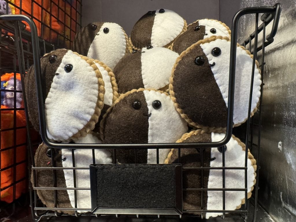 Lucy Sparrow's felted black and white cookies at "Feltz Bagels," her new New York City bagel shop art show. Photo by Sarah Cascone.