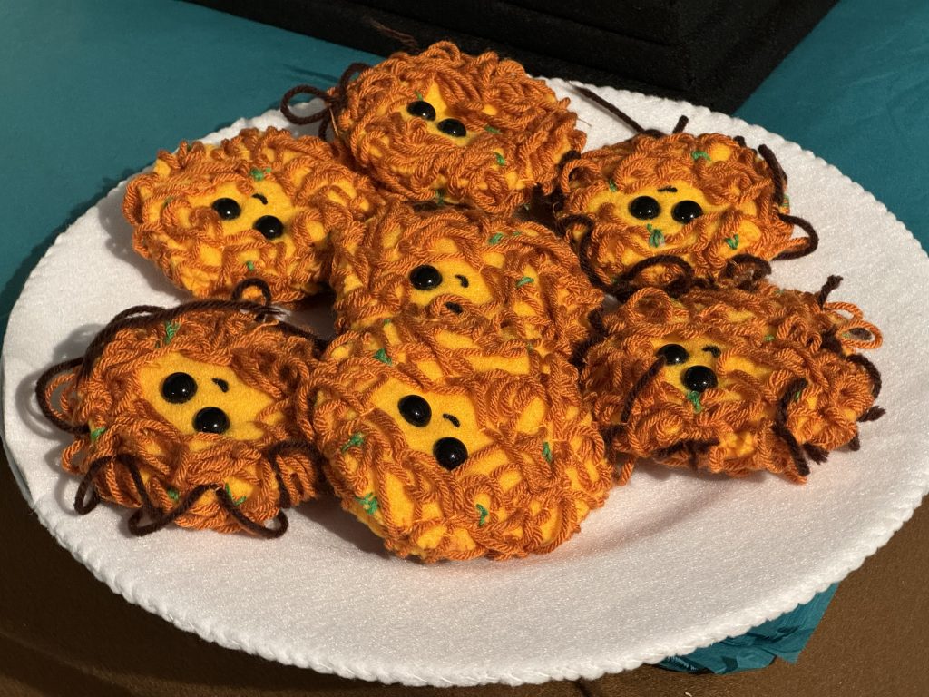 Lucy Sparrow's felted latkes at "Feltz Bagels," her new New York City bagel shop art show. Photo by Sarah Cascone.