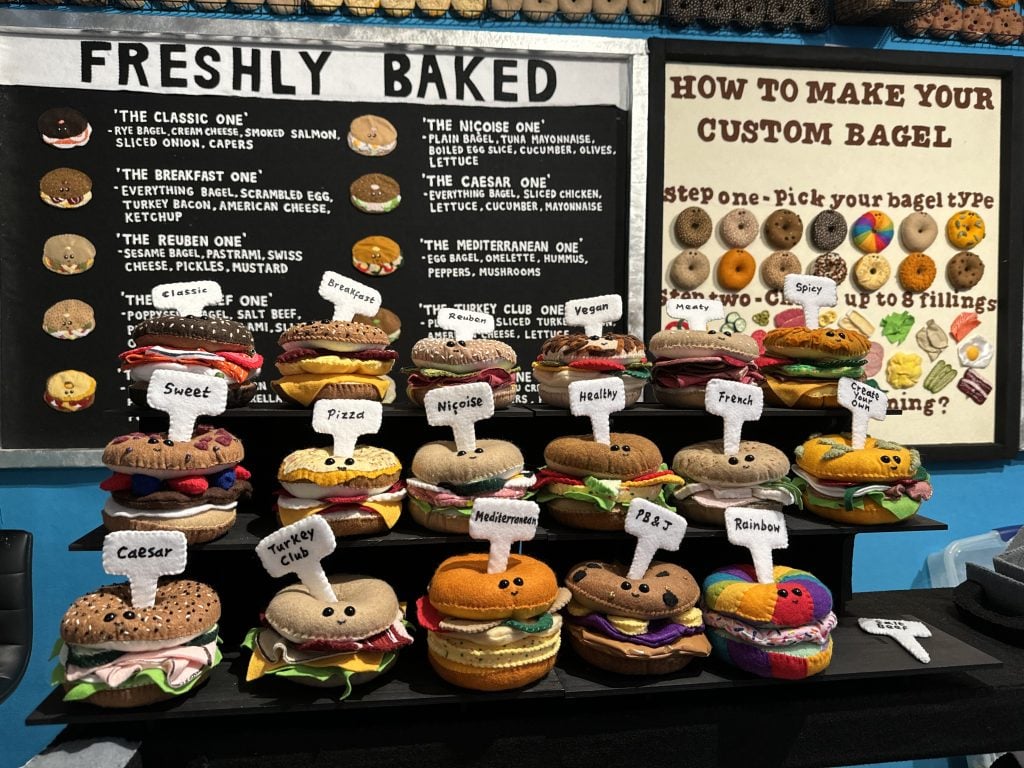 Lucy Sparrow's felted bagels at "Feltz Bagels," her new New York City bagel shop art show. Photo by Sarah Cascone.