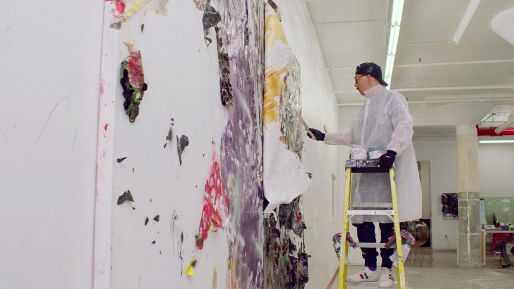 Michael Chow painting in his Los Angeles studio. Photo courtesy of HBO. 