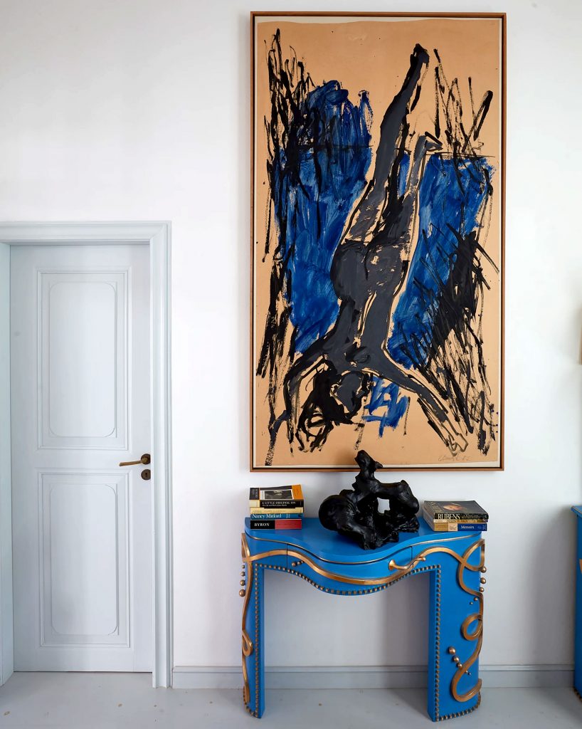Georg Baselitz, <em>Untitled (Weiblicher Akt)</em> (1977), pictured above a unique console table (2009) by Mattia Bonetti. Courtesy of Sotheby's.