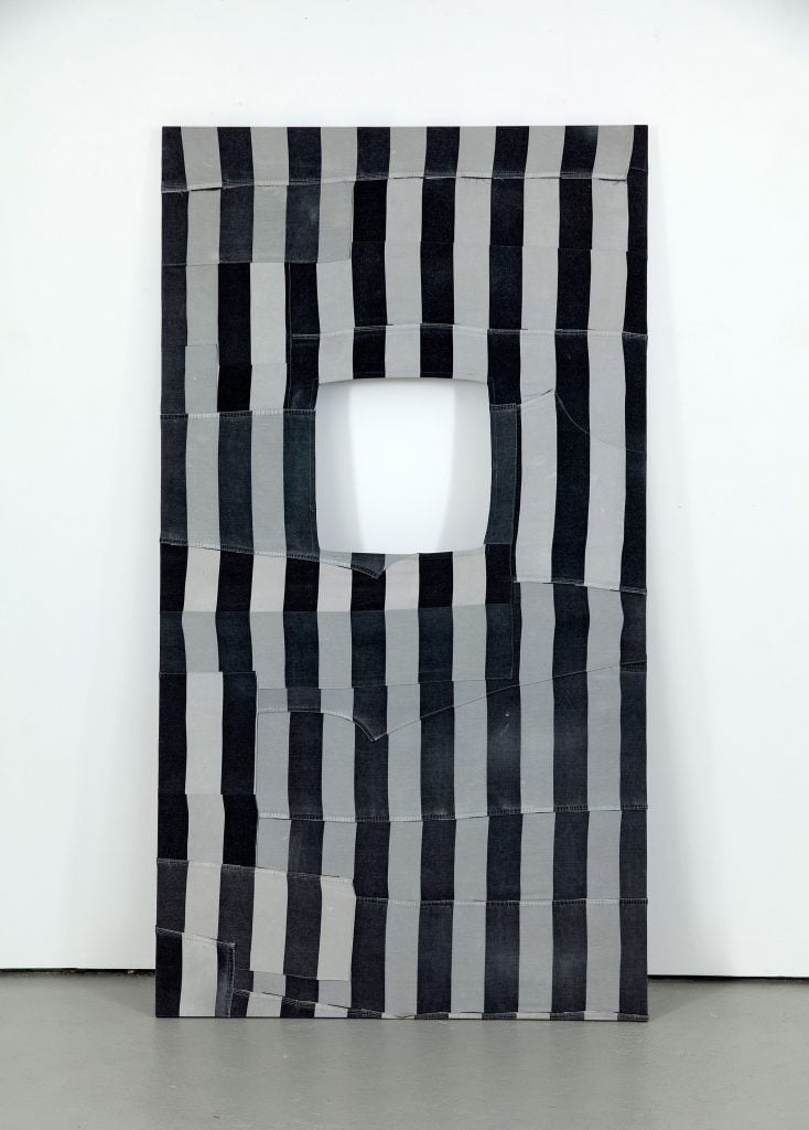 quilt made from decommissioned prison uniforms. Courtesy of Jack Shainman Gallery.