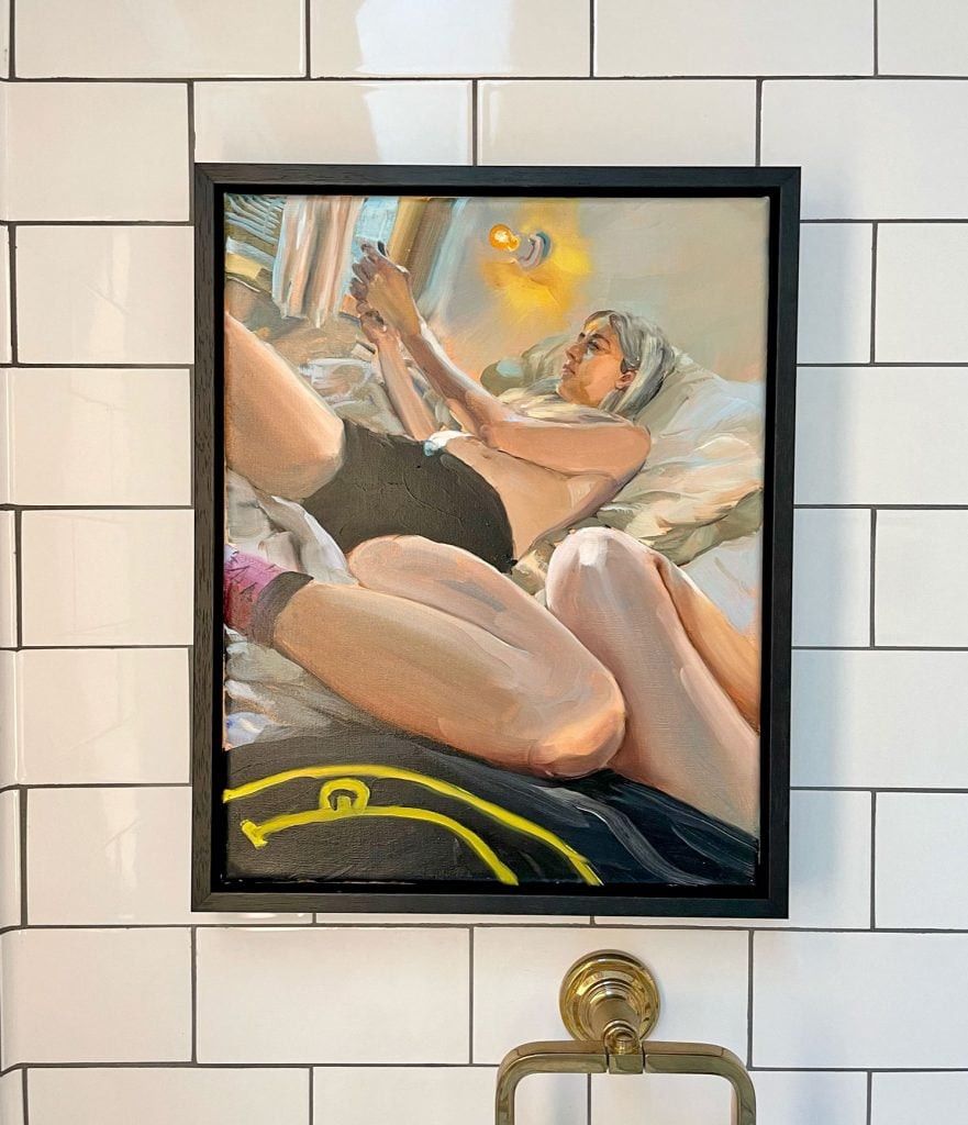 A work by Jenna Gribbon hangs in the bathroom. Courtesy of Pete Scantland.