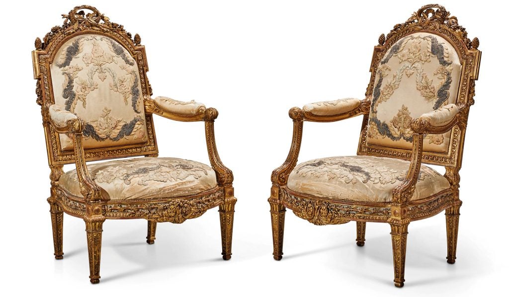 A pair of late Louis XV gilt walnut fauteuils by Louis Delanois, Joseph-Nicolas Guichard, and Jean-Baptiste Cagny for Madame du Barry (ca. 1770–71). Courtesy of Christie's.