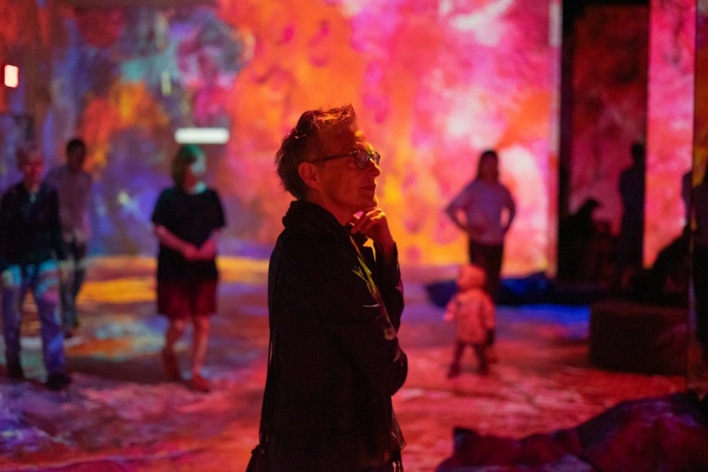 Marc Chagall's granddaughter Bella Meyer takes in an immersive installation of his work at Hall des Lumieres in lower Manhattan in October 2023.