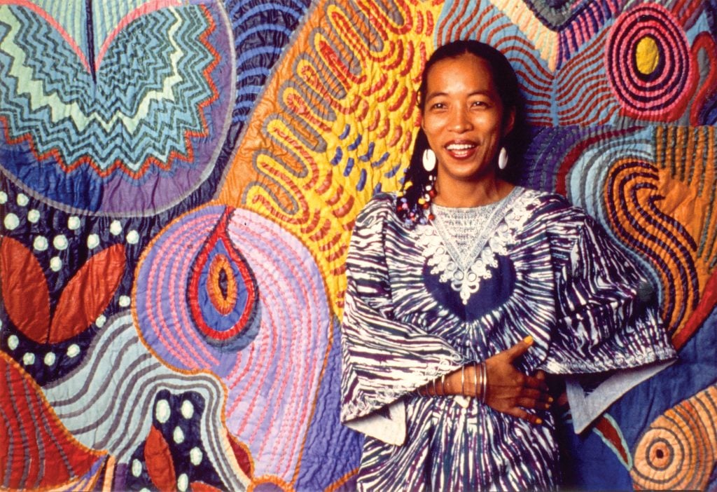 Pacita Abad with her trapunto painting Ati-Atihan, 1983. Photo courtesy of the Pacita Abad Art Estate.
