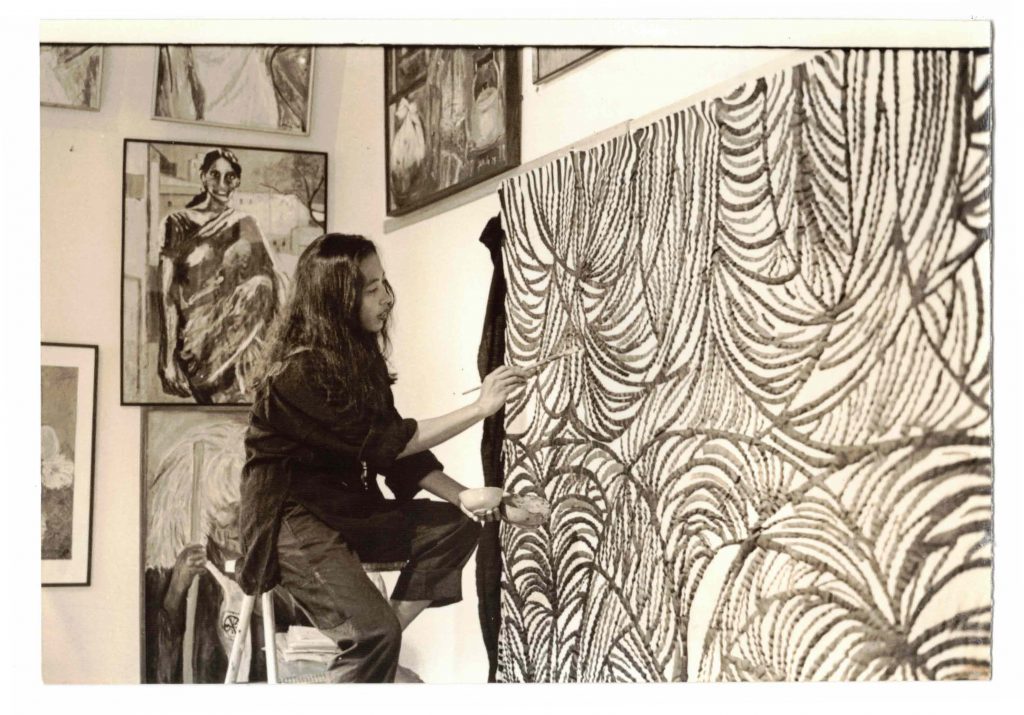 Portrait of Pacita Abad at work in her Manila studio in 1984. Photo courtesy of the Pacita Abad Art Estate.