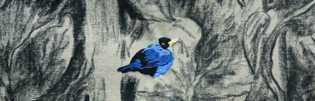 A detail image of an embroidered bird on Nohemí Pérez's Un lugar en Orito. Courtesy of Artbo. 