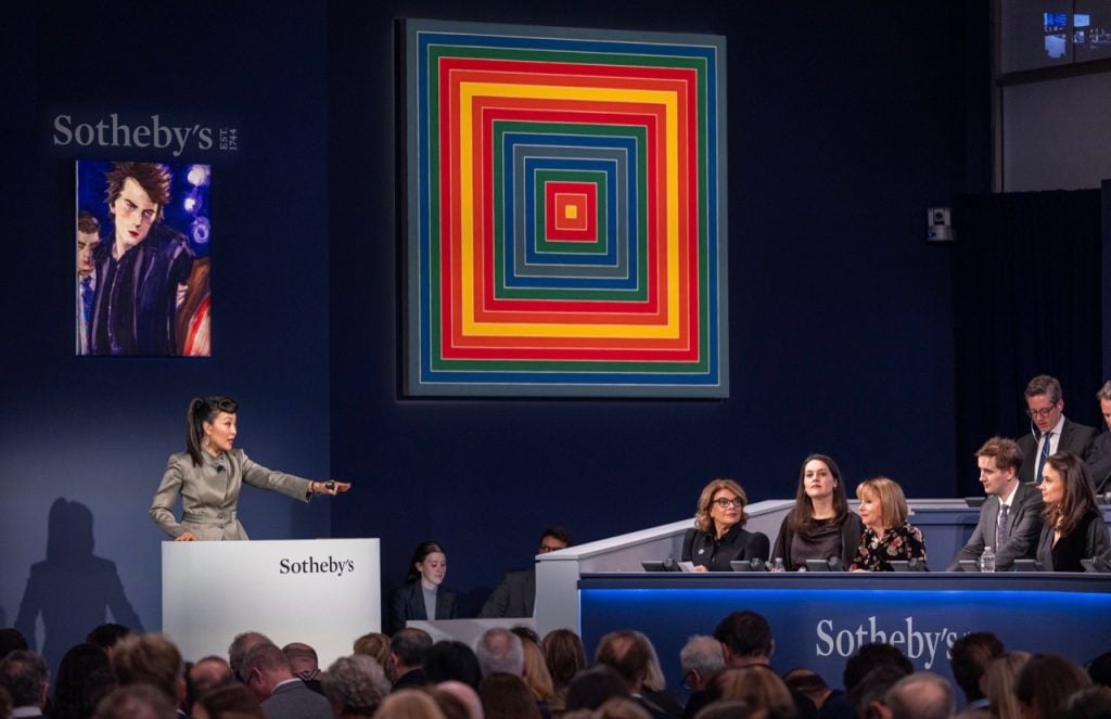 Phyllis Kao, from Sotheby's client strategy team, fields bids in The Now sale, her first evening auction. Image courtesy Sotheby's