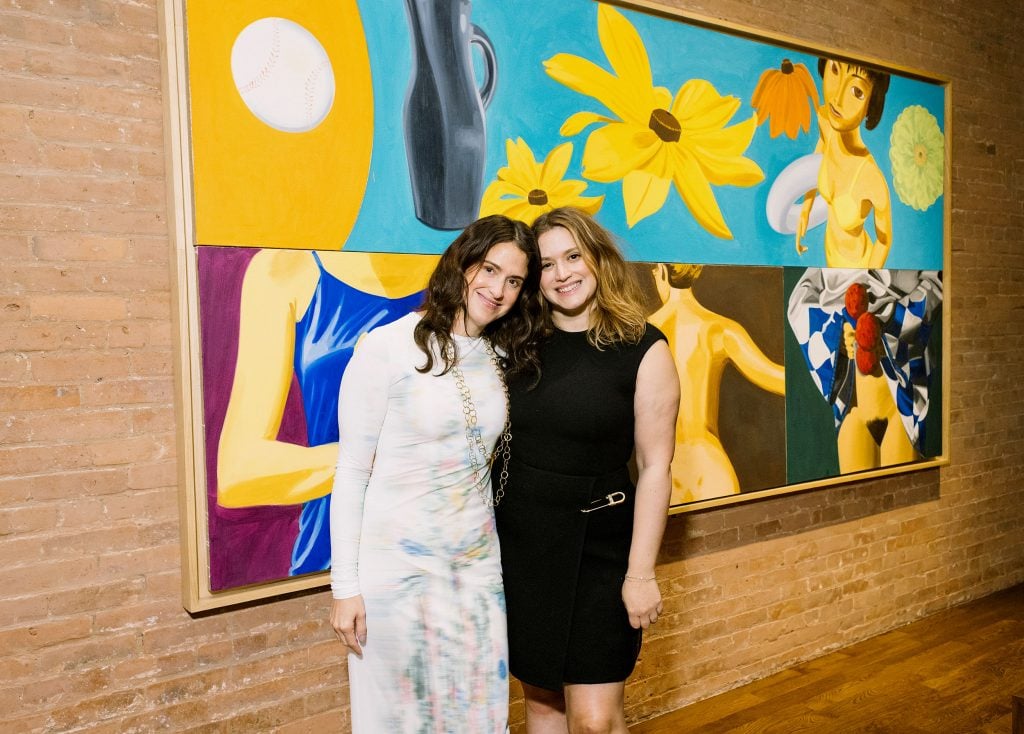 Alexandra and Roselyn Mathews at the opening of the Lucifer Lighting showroom in Tribeca on October 26, 2023, with David Salle's Black Eyed Susan with Envy (2002). Photo: Yvonne Tnt, BFA, 2023.