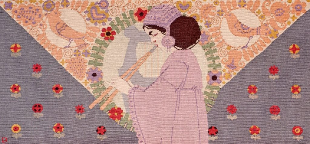 Rudolf Livora, Girl With Flute tapestry (ca. 1908), located in the booth of Bernard Goldberg Fine Art.