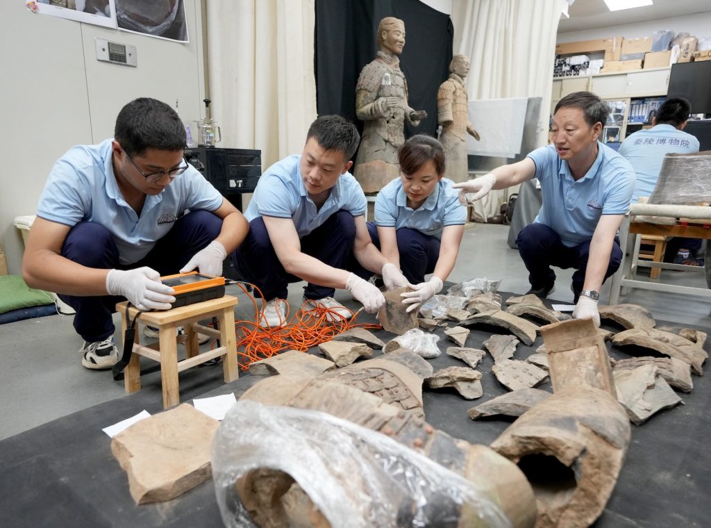 Terracotta Army Restoration Team (2023). Photo by Wang Yuguo / Xinhua via Getty Images.