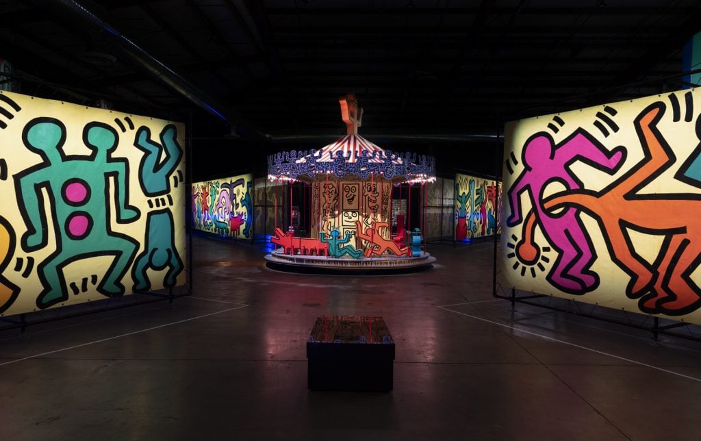Installation view of "Luna Luna: Forgotten Fantasy," featuring Keith Haring's painted carousel and murals. Photo: Jeff McLane.