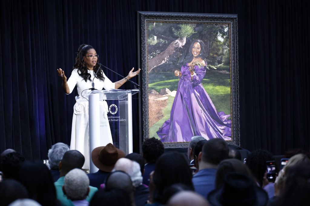 Oprah Winfrey speaks on stage during her portrait unveiling ceremony at Smithsonian National Portrait Gallery on December 13, 2023 in Washington, DC. Photo: Paul Morigi/Getty Images for Smithsonian's National Portrait Gallery.